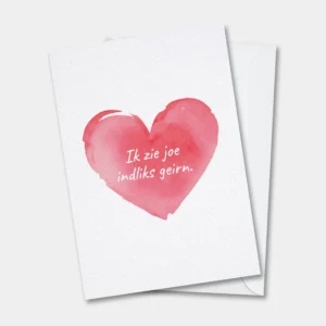 West-Vlaamse wenskaart met de tekst "Ik zie joe indliks geirn." In een hartje.